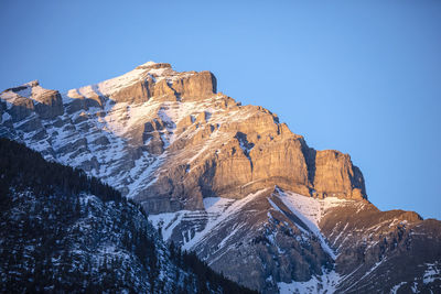 Scenic view of snowcapped mountains against clear sky