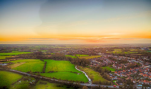 Aerial view of landscape against sky during sunset