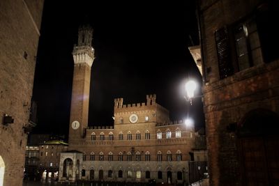 Illuminated buildings in city at night