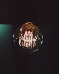 Close-up of illuminated light bulb