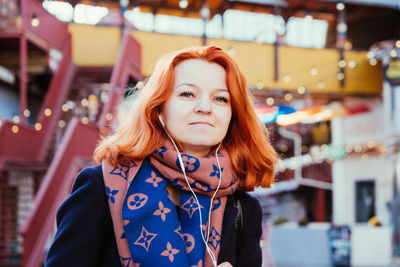 Portrait of beautiful young woman standing outdoors