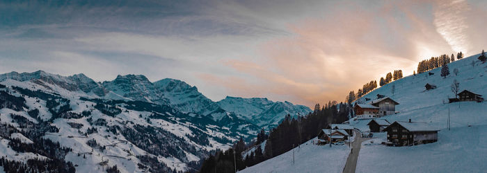 Scenic view of snowcapped mountains against sky during winter