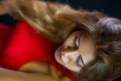 Close-up of young woman sleeping at home