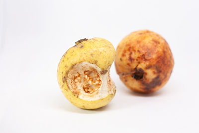 Close-up of fruits against white background