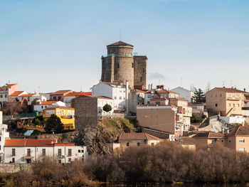 Buildings in city against sky