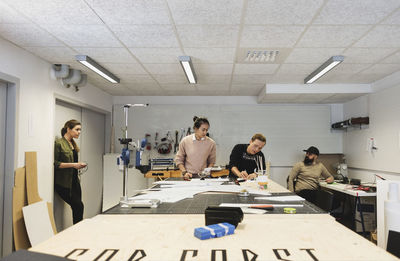 Engineers working on table in creative office