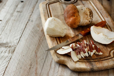 High angle view of bread on cutting board