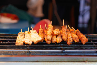 Meat on barbecue grill at concession stand