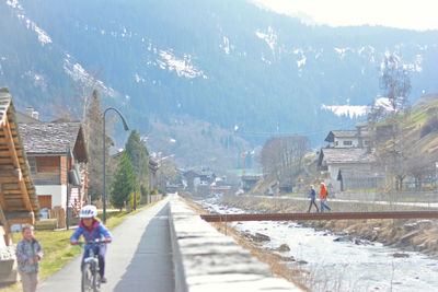 People walking on road in city