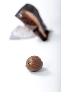 Close-up of coffee beans against white background