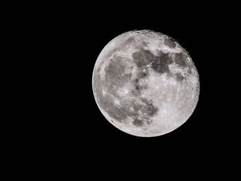 Scenic view of full moon against sky at night