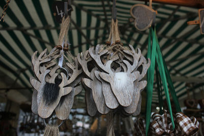 Low angle view of decorations hanging on ceiling at night