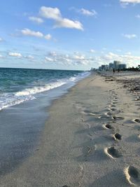 Surface level of beach against sky