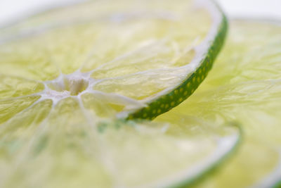 Cropped image of fresh juicy lemon slices on white background