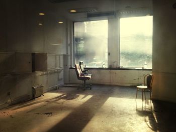 Empty chair in abandoned interior