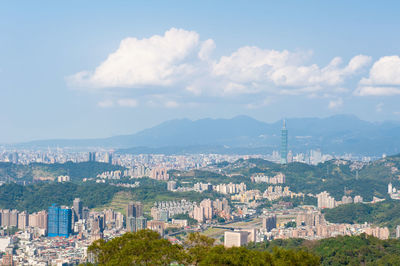 High angle view of buildings in city against sky