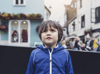 Portrait of boy standing outdoors