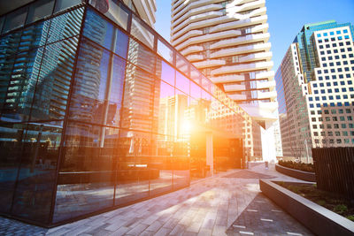 Modern buildings against sky in city