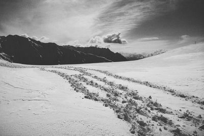 Scenic view of landscape against sky during winter