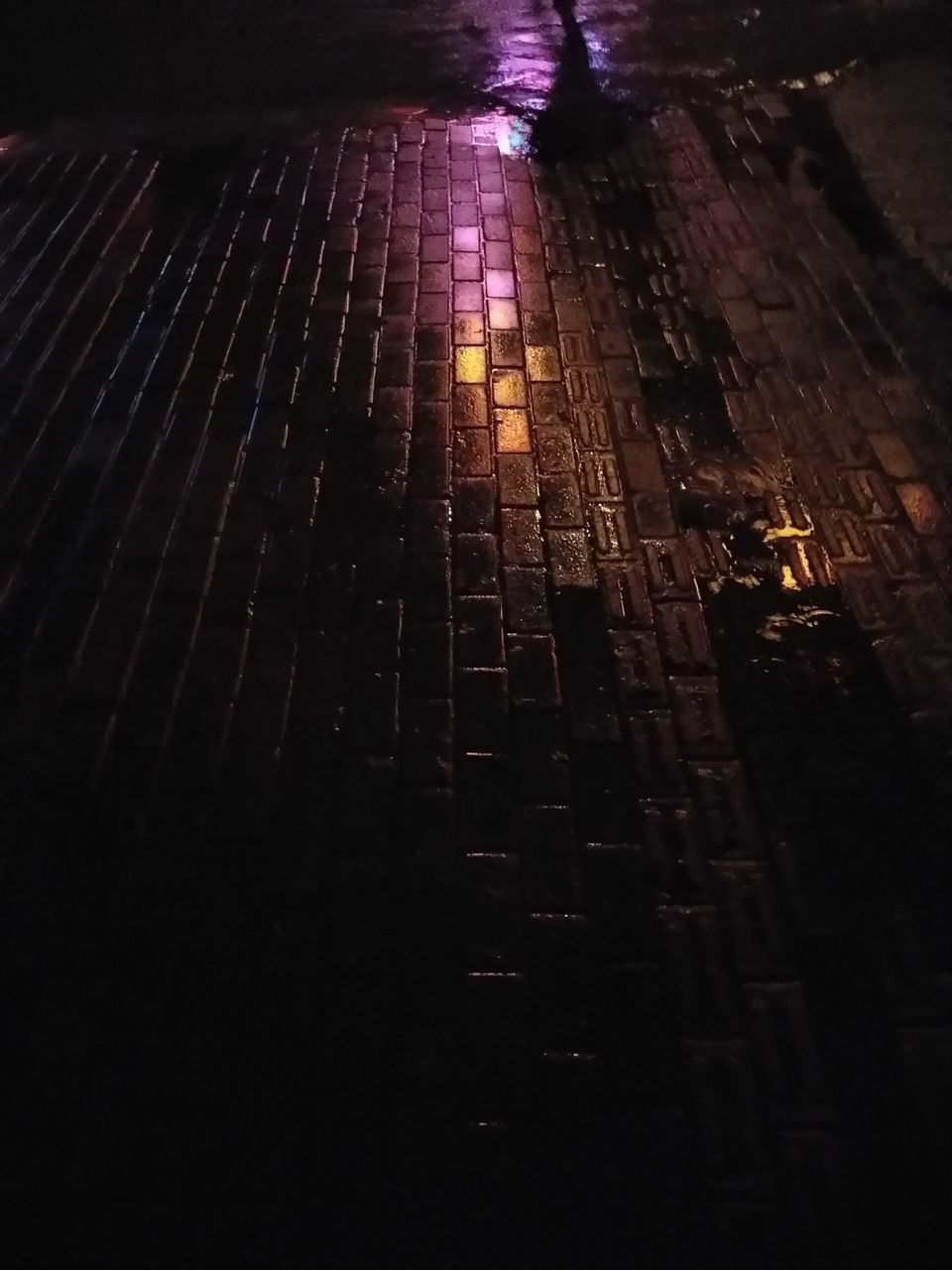 HIGH ANGLE VIEW OF STREET AMIDST BUILDINGS IN CITY AT NIGHT