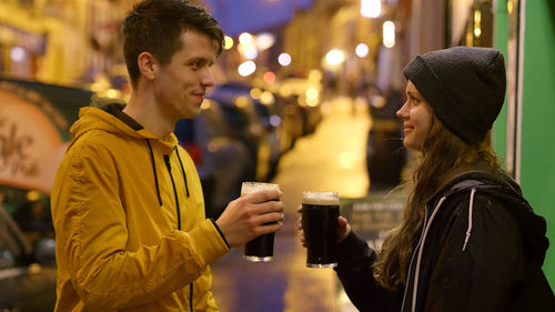 Side view of a smiling young couple