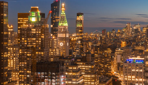 Illuminated buildings in city at night