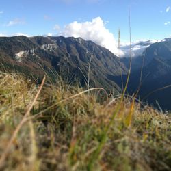 Surface level of countryside landscape against mountain range