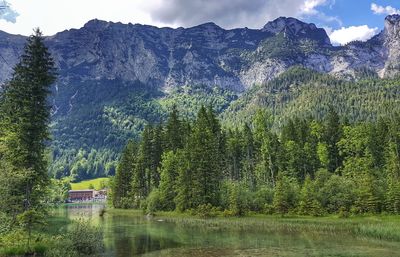 Scenic view of lake and mountains against sky