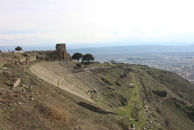 High angle view of castle on landscape against sky