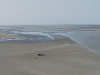 Scenic view of beach against clear sky