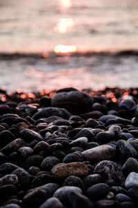 Surface level of pebbles at sunset