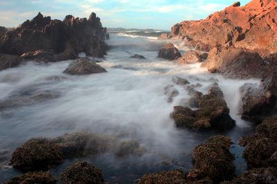 Scenic view of water streaming through rocks