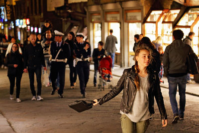 Group of people walking in corridor