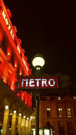 Low angle view of illuminated street light at night