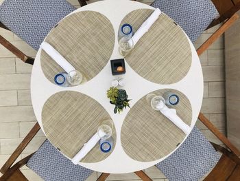 High angle view of chairs on table