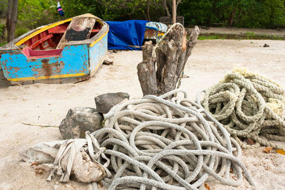 View of fishing boat moored at beach