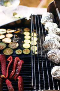 High angle view of meat on barbecue grill