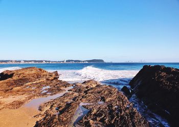 View of calm blue sea against clear sky