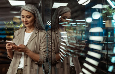 Young woman using mobile phone