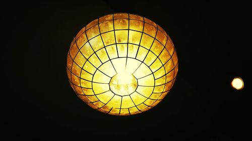 Low angle view of lit lamp