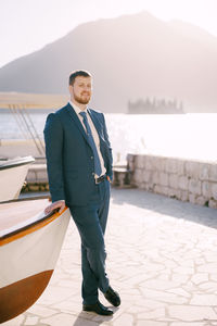 Portrait of man standing in boat