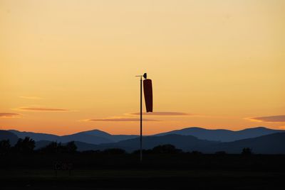 Scenic view of landscape against sky at sunset