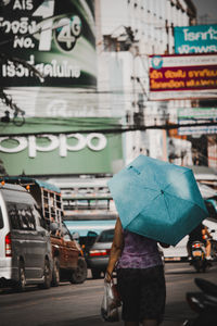 Rear view of man walking on street