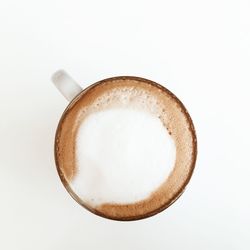 Directly above shot of coffee cup against white background