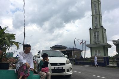 People on road against sky