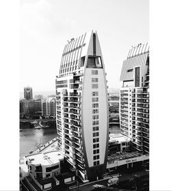 Skyscrapers in city against clear sky