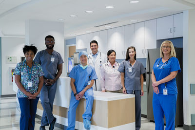 Portrait of smiling doctors and nurses at hospital reception