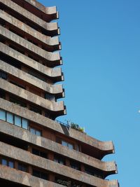 Low angle view of building against clear blue sky