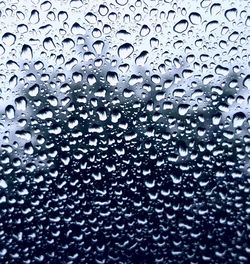 Close-up of water drops on glass