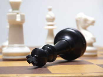 Close-up of chess pieces on floor